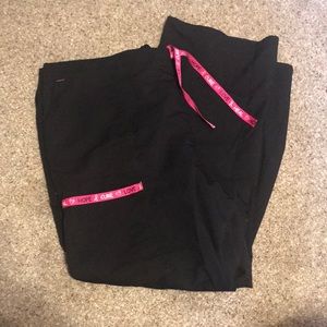 Black scrub pants. Breast cancer awareness.